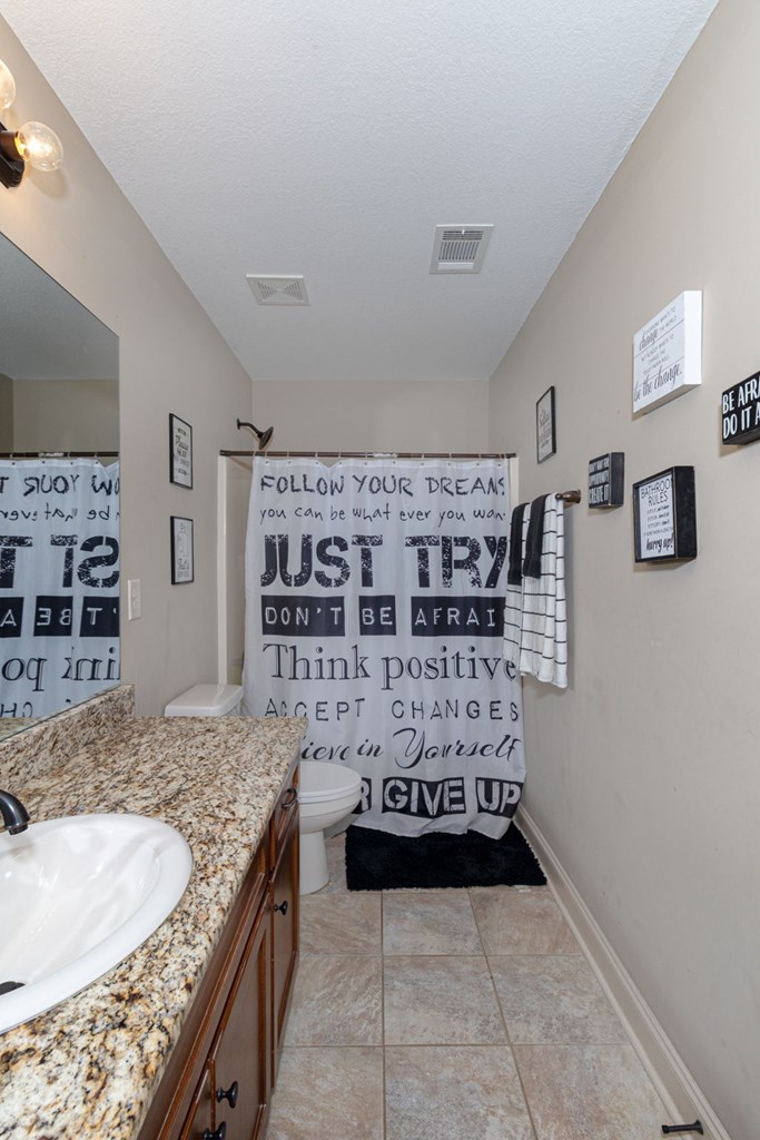 53 Winter Hawk Drive Fort Mitchell, AL 36856 - Photo 24 of 39 a kitchen with a stove and refrigerator