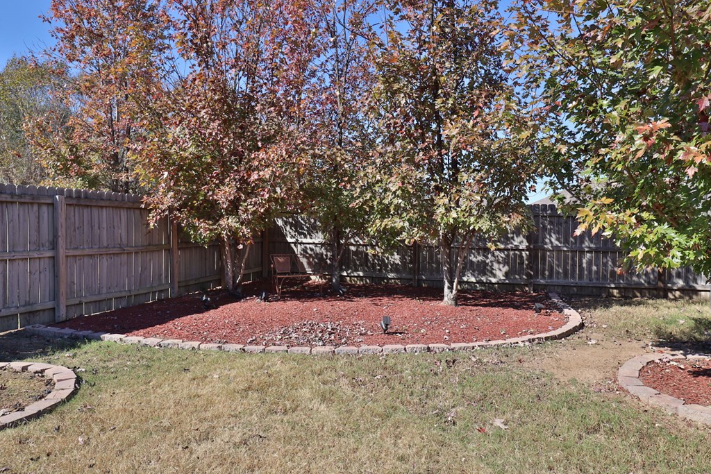 53 Winter Hawk Drive Fort Mitchell, AL 36856 - Photo 37 of 39 a backyard of a house with table and chairs