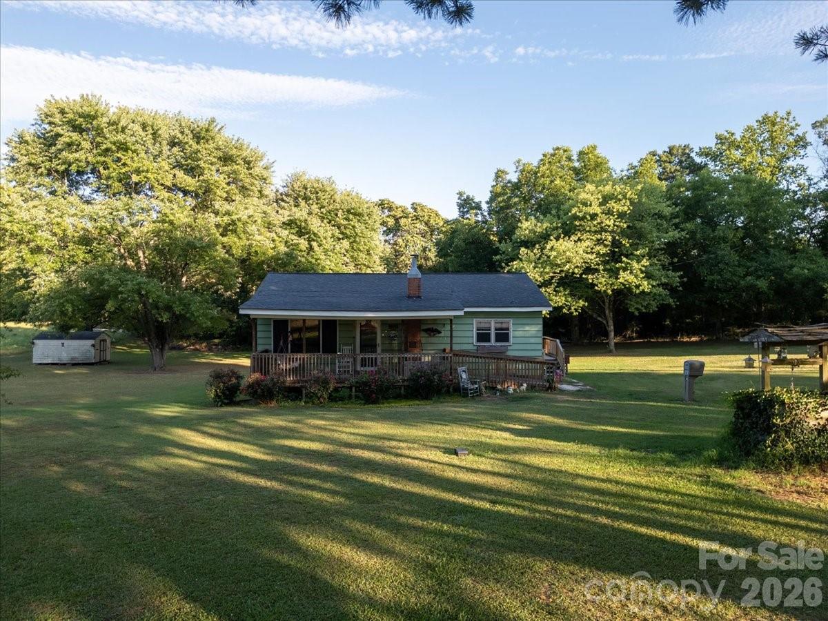 12282 Coyle Road Stanfield, NC 28163 - Photo 16 of 24 a view of a house with a big yard