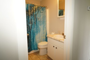 11753 Harcum Road Gloucester, VA 23061 - Photo 19 of 27 Full bath featuring vanity, a shower with curtain, and light tile patterned floors
