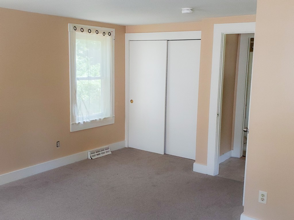134 Telegraph Road Dennis, MA 02639 - Photo 8 of 12 a view of an empty room with a window