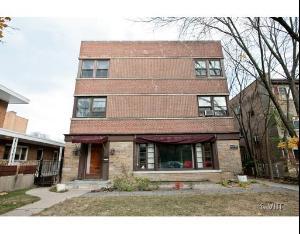 7231 North Ridge Boulevard, Unit 1E Chicago, IL 60645 - Photo 1 of 9 a view of a white building with large windows