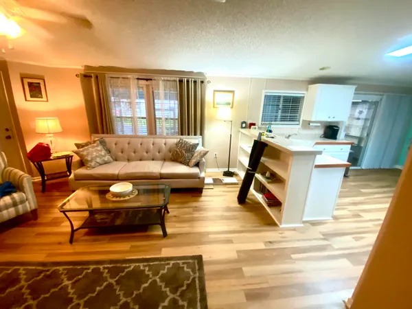 a living room with furniture and a table