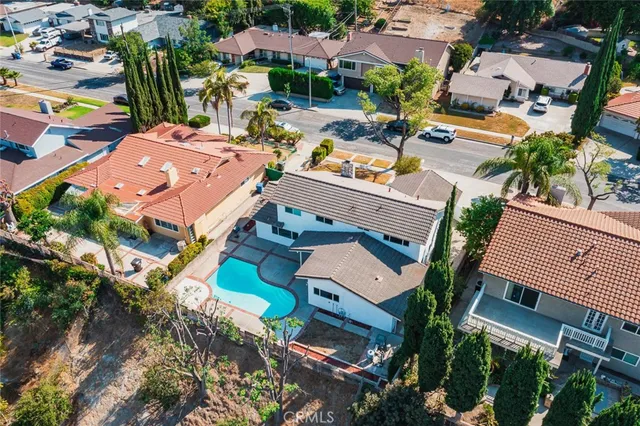 an aerial view of a houses with yard