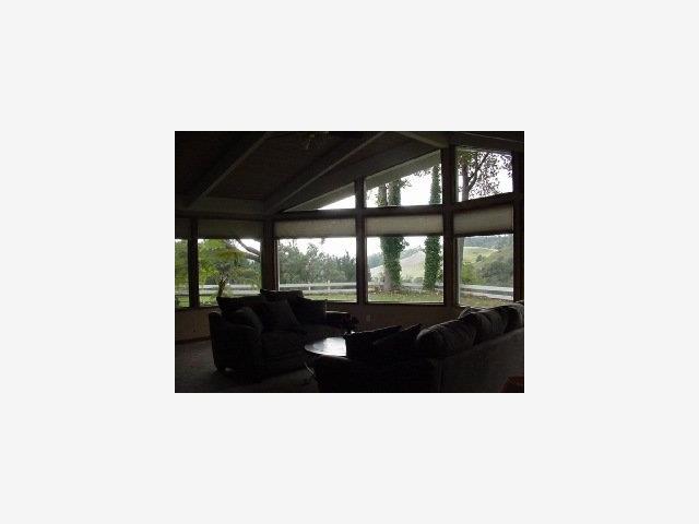 2602 North Rodeo Gulch Road Soquel, CA 95073 - Photo 8 of 8 a living room with furniture and floor to ceiling window