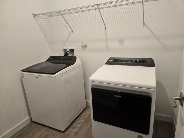 a utility room with dryer and washer