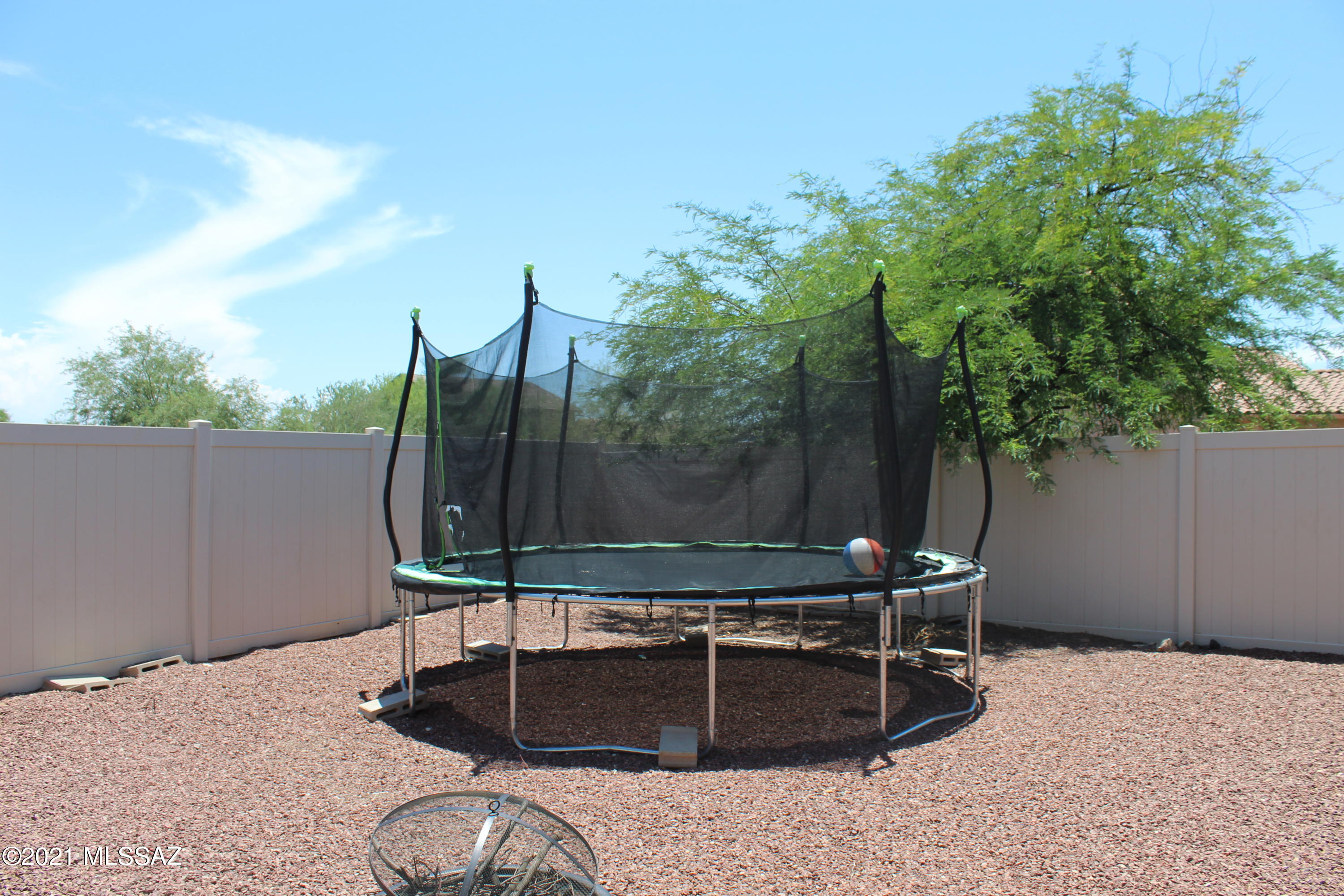 20951 East Reunion Road Red Rock, AZ 85145 - Photo 32 of 35 a backyard of a house with table and chairs