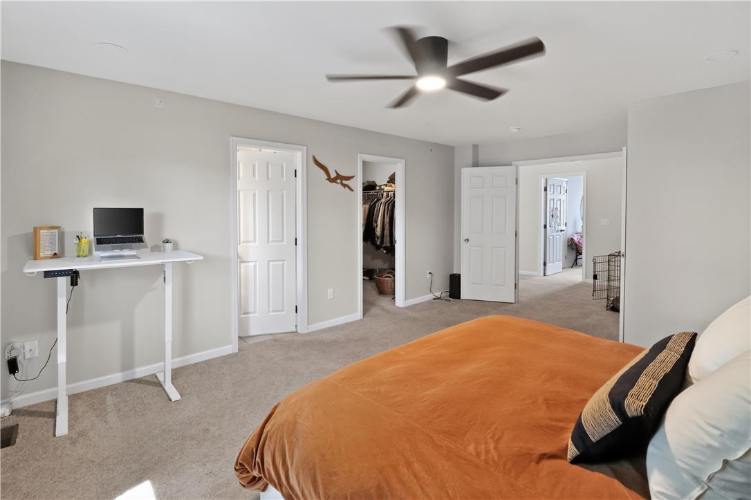 4502 Benjamin Court Emmaus, PA 18049 - Photo 27 of 48 A quiet retreat, this bedroom offers carpeted flooring, a ceiling fan for comfort, and a walk-in closet.