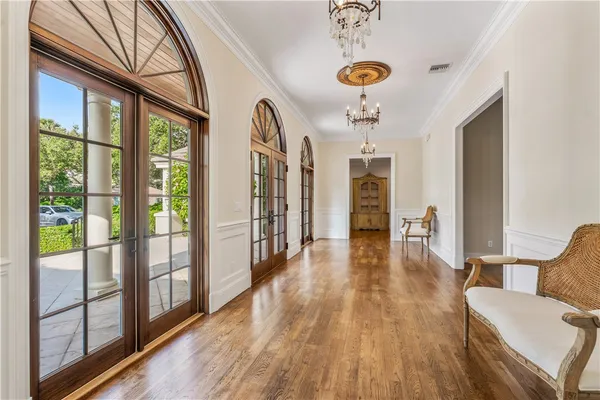 a view of lobby with furniture and wooden floor