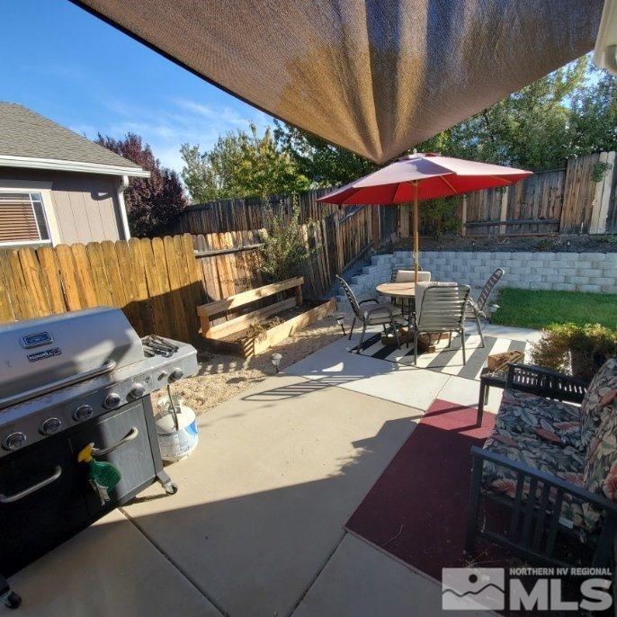 7798 Welsh Drive Reno, NV 89506 - Photo 17 of 18 a view of backyard with seating space and wooden floor