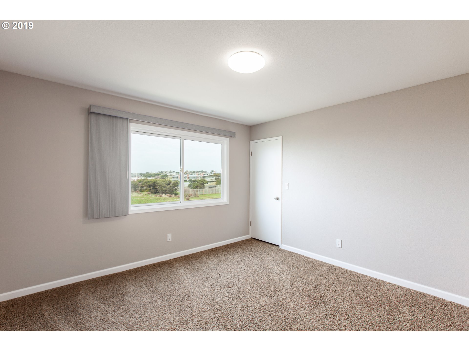 Windward Condo Gearhart, OR 97138 - Photo 20 of 24 an empty room with windows