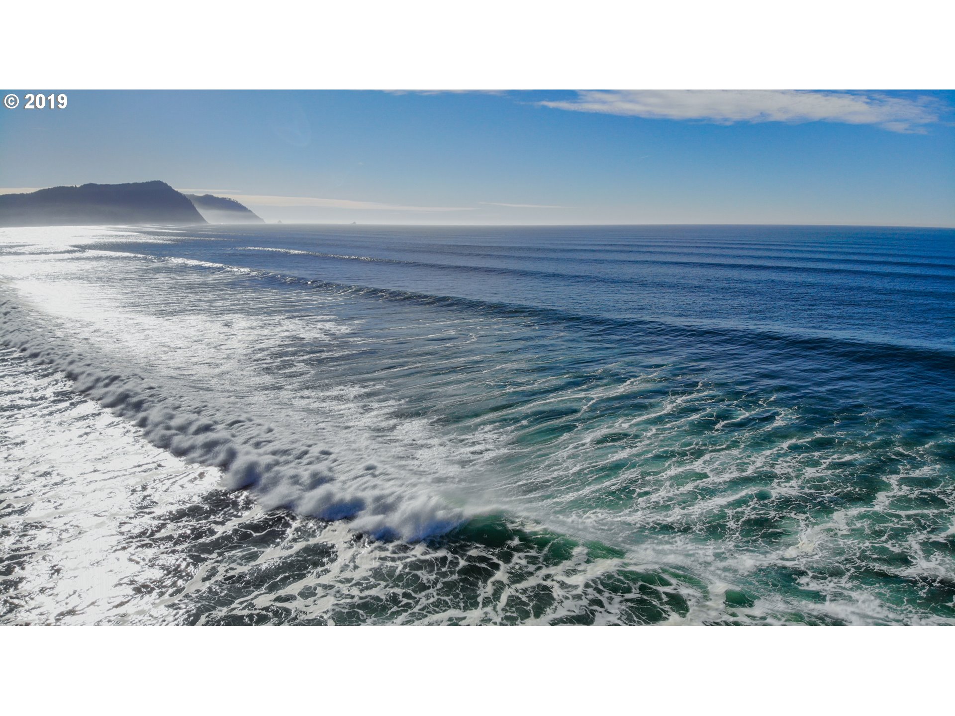 Windward Condo Gearhart, OR 97138 - Photo 3 of 24 a open hall with a bench in it