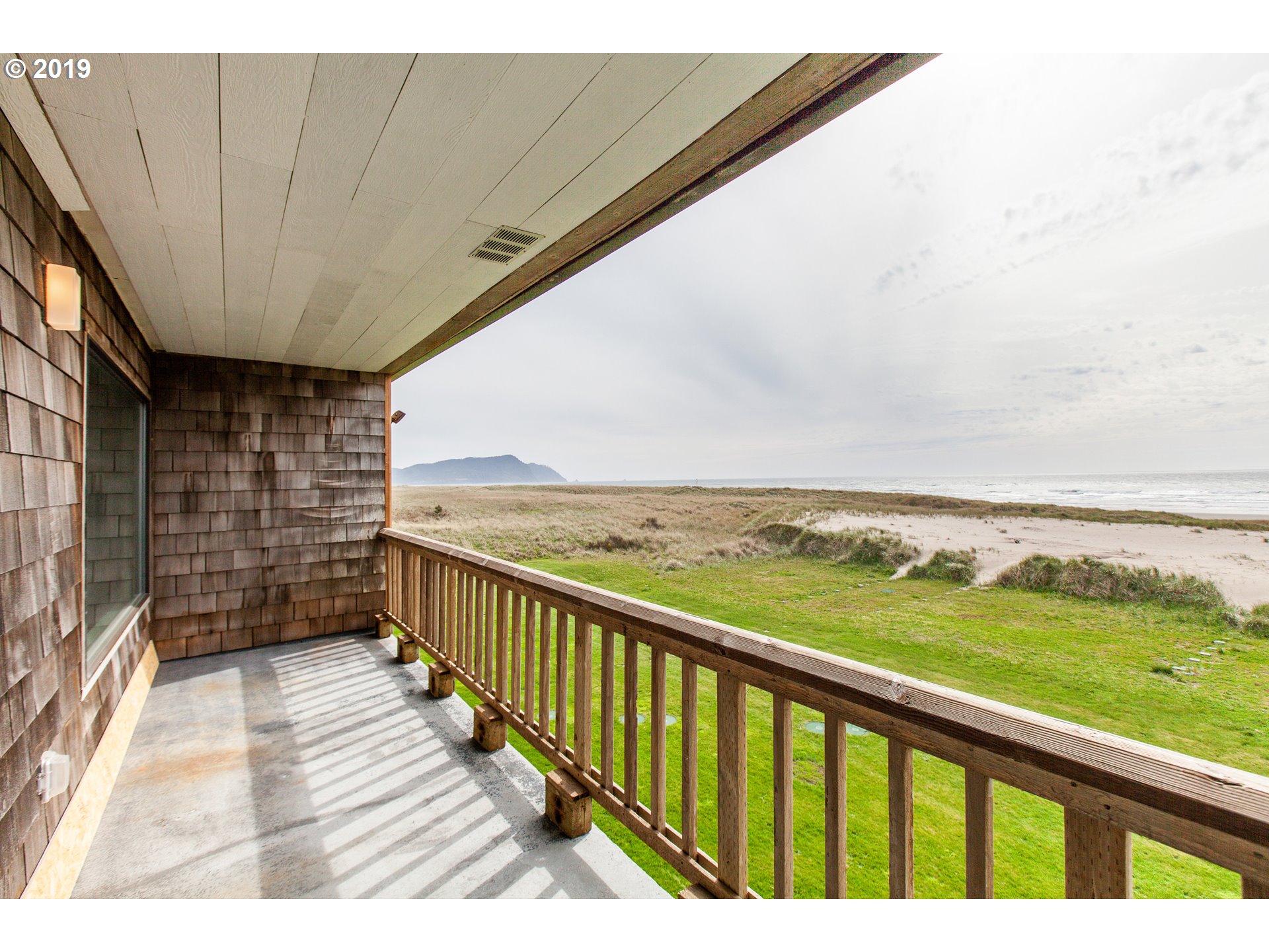Windward Condo Gearhart, OR 97138 - Photo 7 of 24 a view of balcony with yard