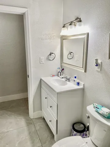 a bathroom with a shower and toilet