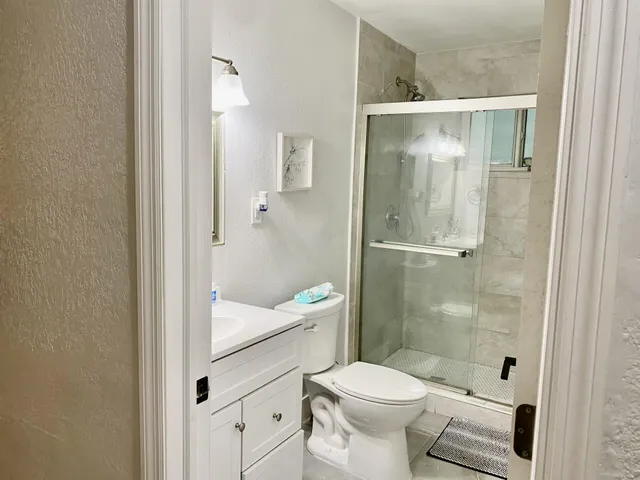 a bedroom with a bed and a fireplace