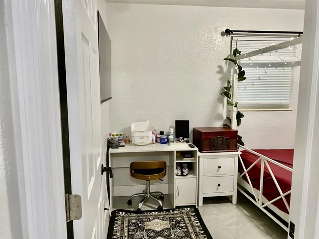 a bedroom with a bed and a walk in closet