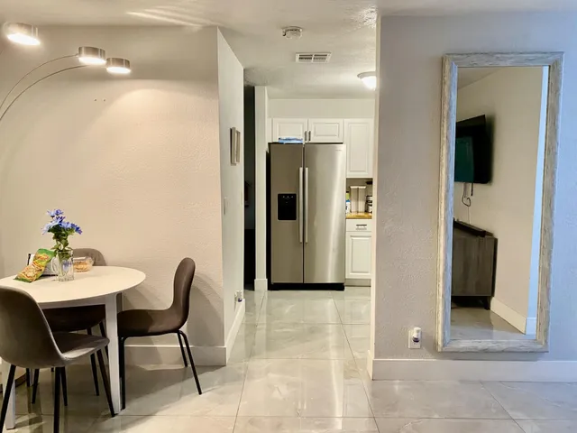 a kitchen with a refrigerator stove and sink