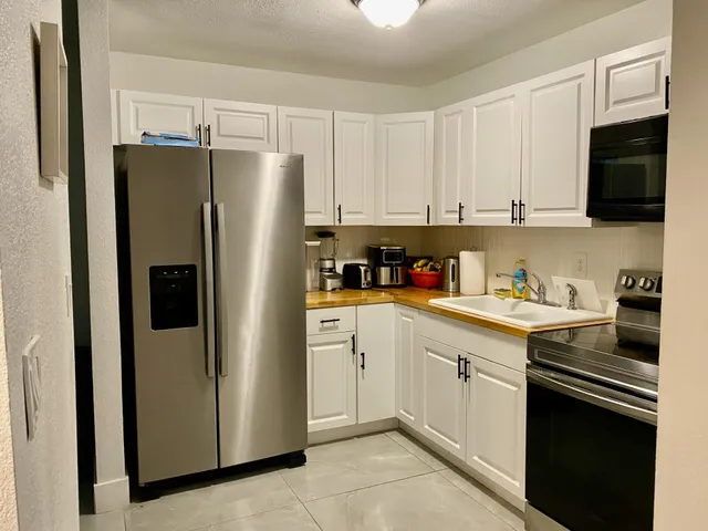 a view of a hallway with a dining area