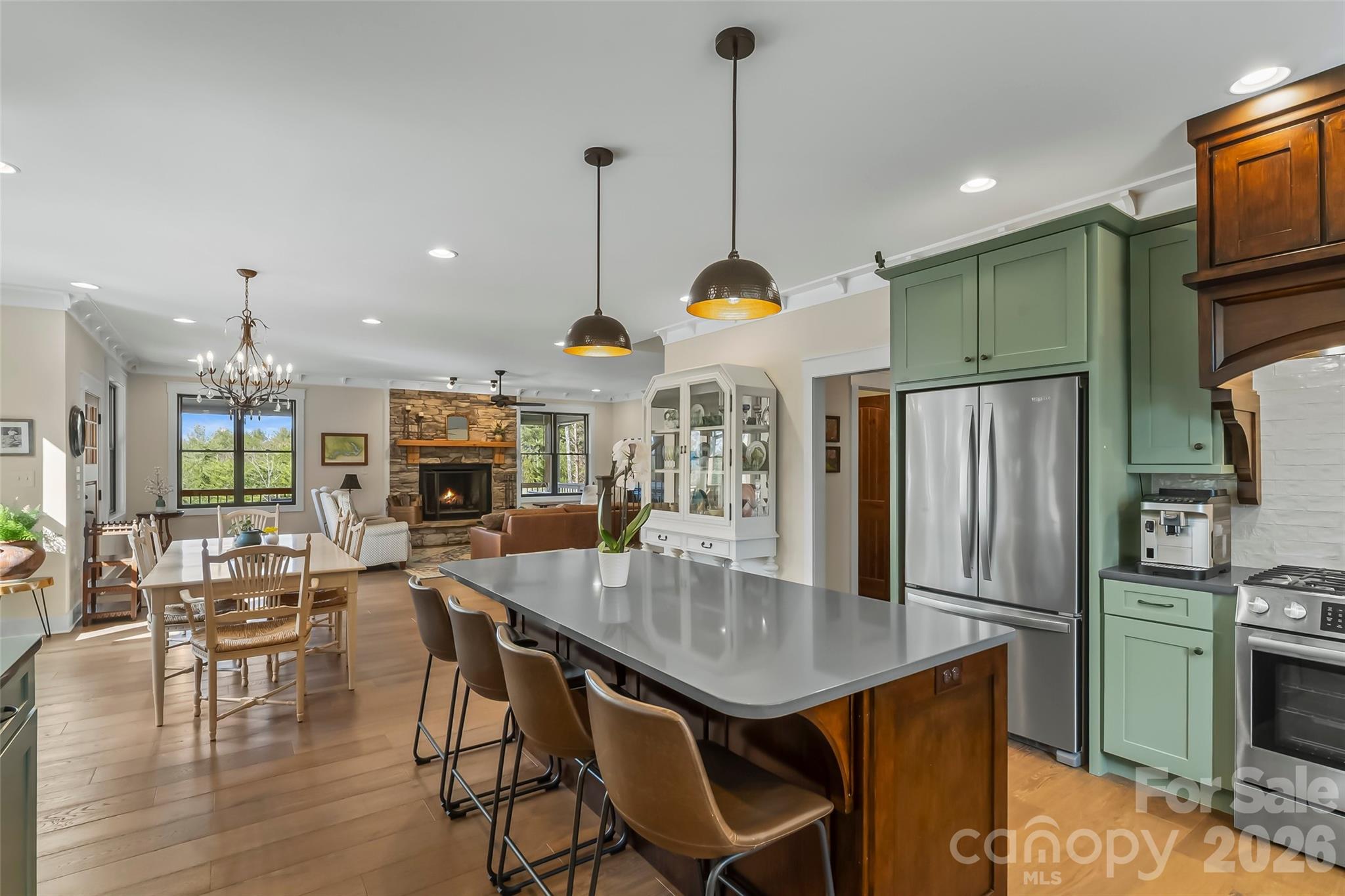 1267 Ten Whigs Ridge Nebo, NC 28761 - Photo 14 of 48 a kitchen with stainless steel appliances granite countertop a kitchen island a table and chairs