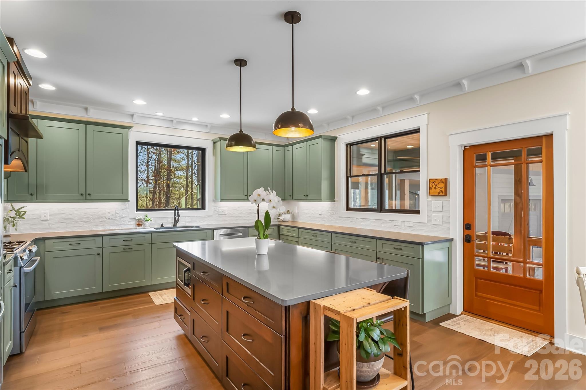 1267 Ten Whigs Ridge Nebo, NC 28761 - Photo 16 of 48 a kitchen with center island table and chairs