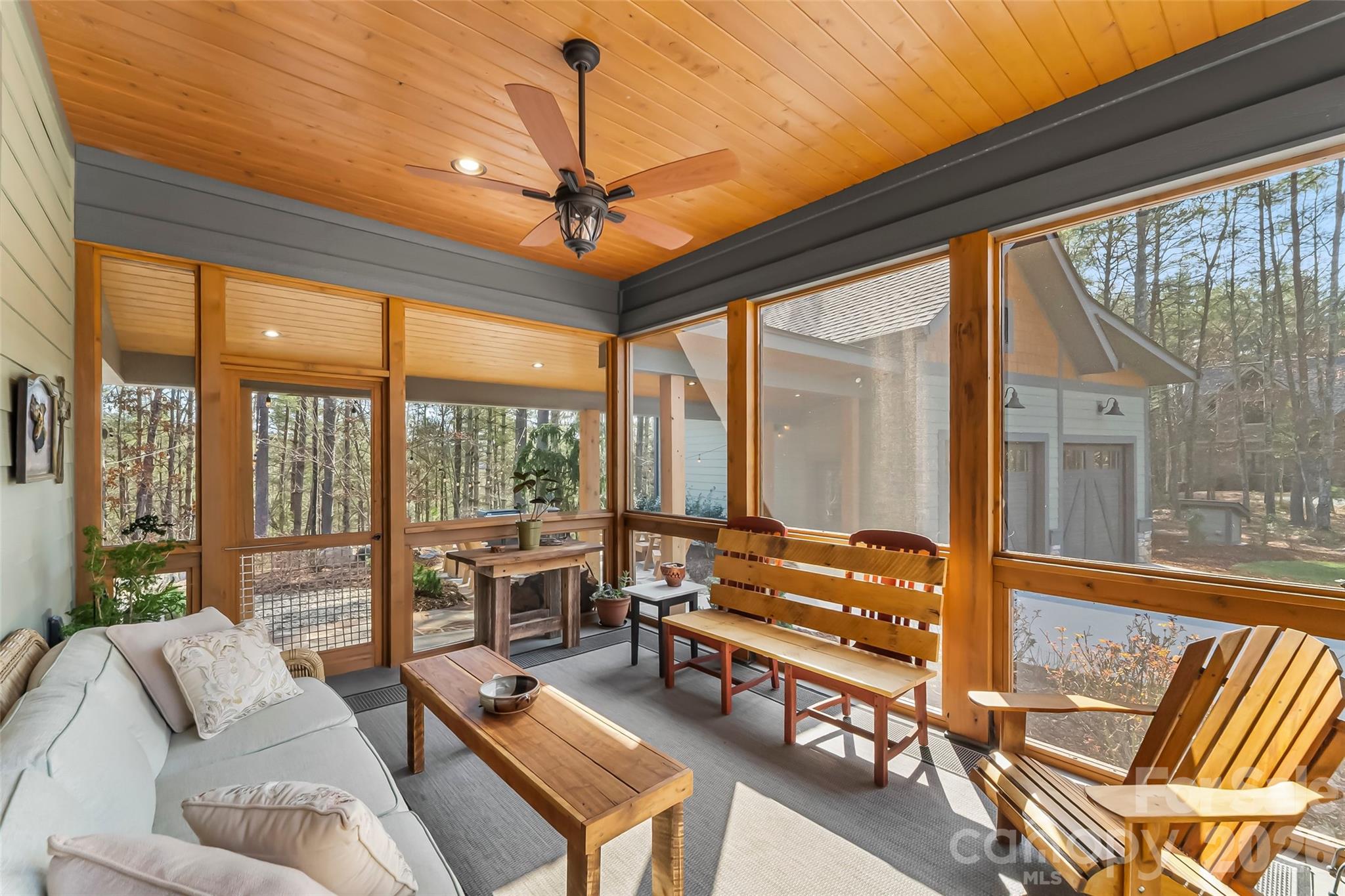 1267 Ten Whigs Ridge Nebo, NC 28761 - Photo 17 of 48 a living room with furniture a ceiling fan and a flat screen tv