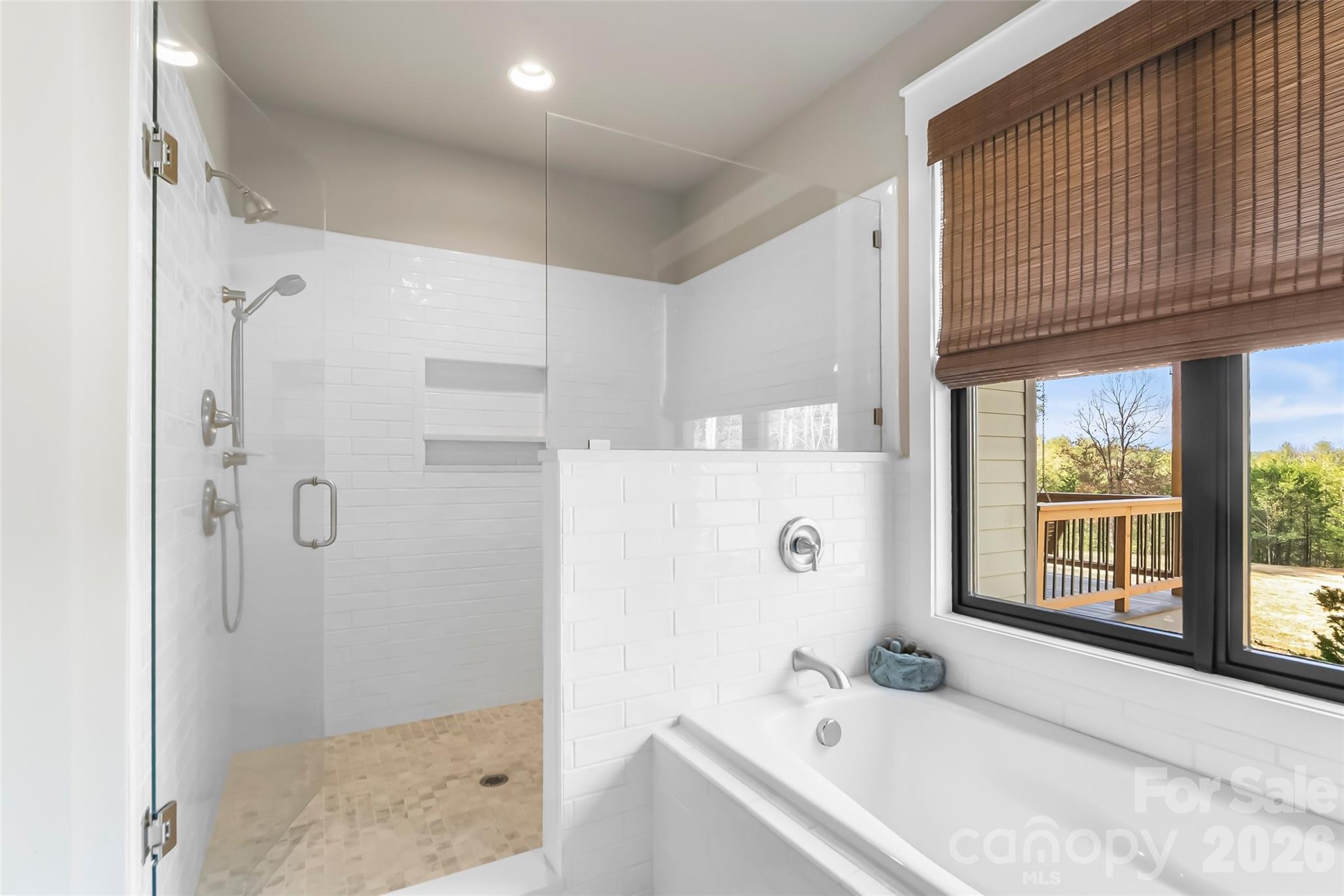 1267 Ten Whigs Ridge Nebo, NC 28761 - Photo 22 of 48 a bathroom with a tub a sink and a window
