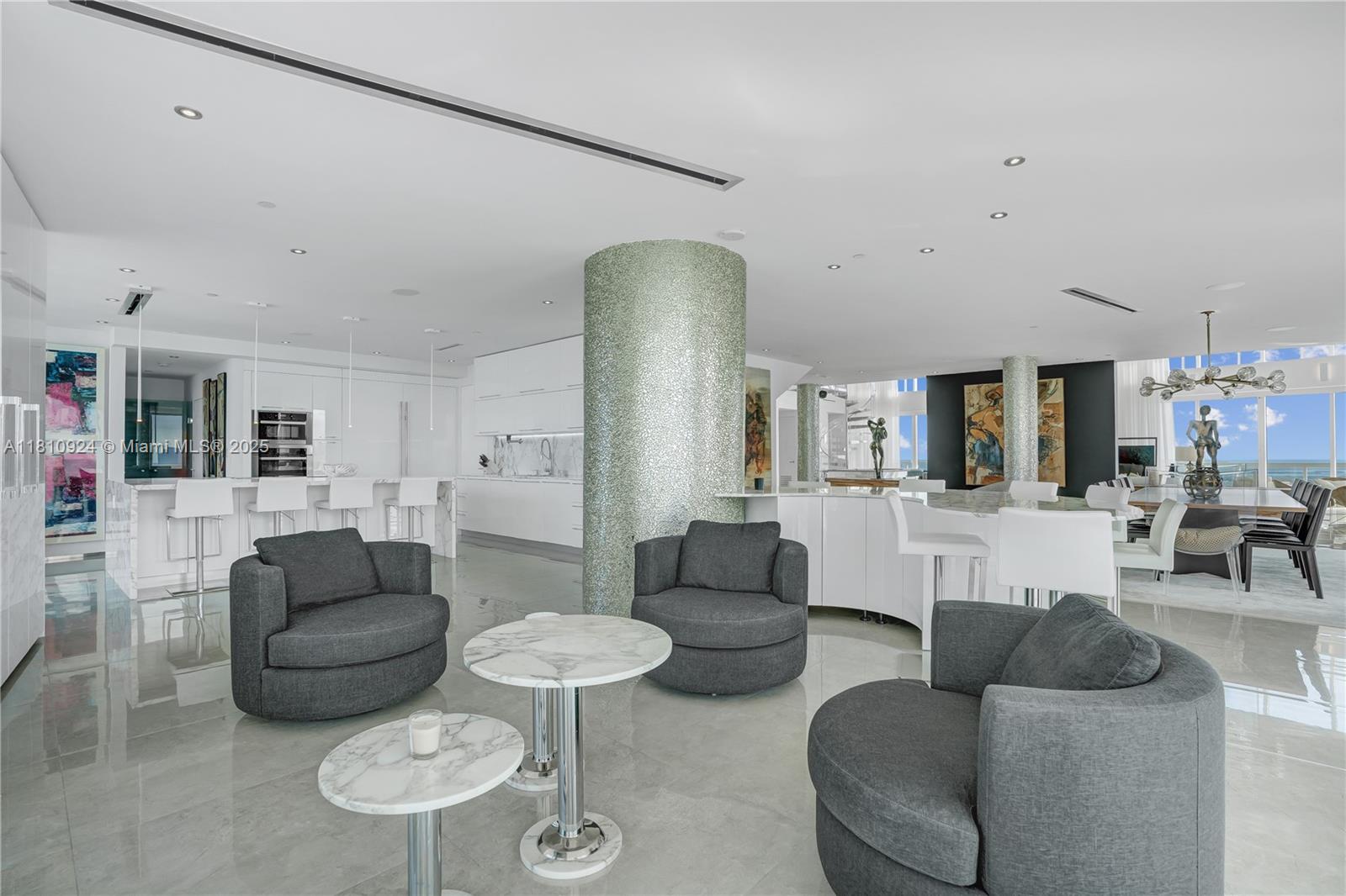 450 Alton Road, Unit PH1 Miami Beach, FL 33139 - Photo 11 of 47 a living room with furniture and a table