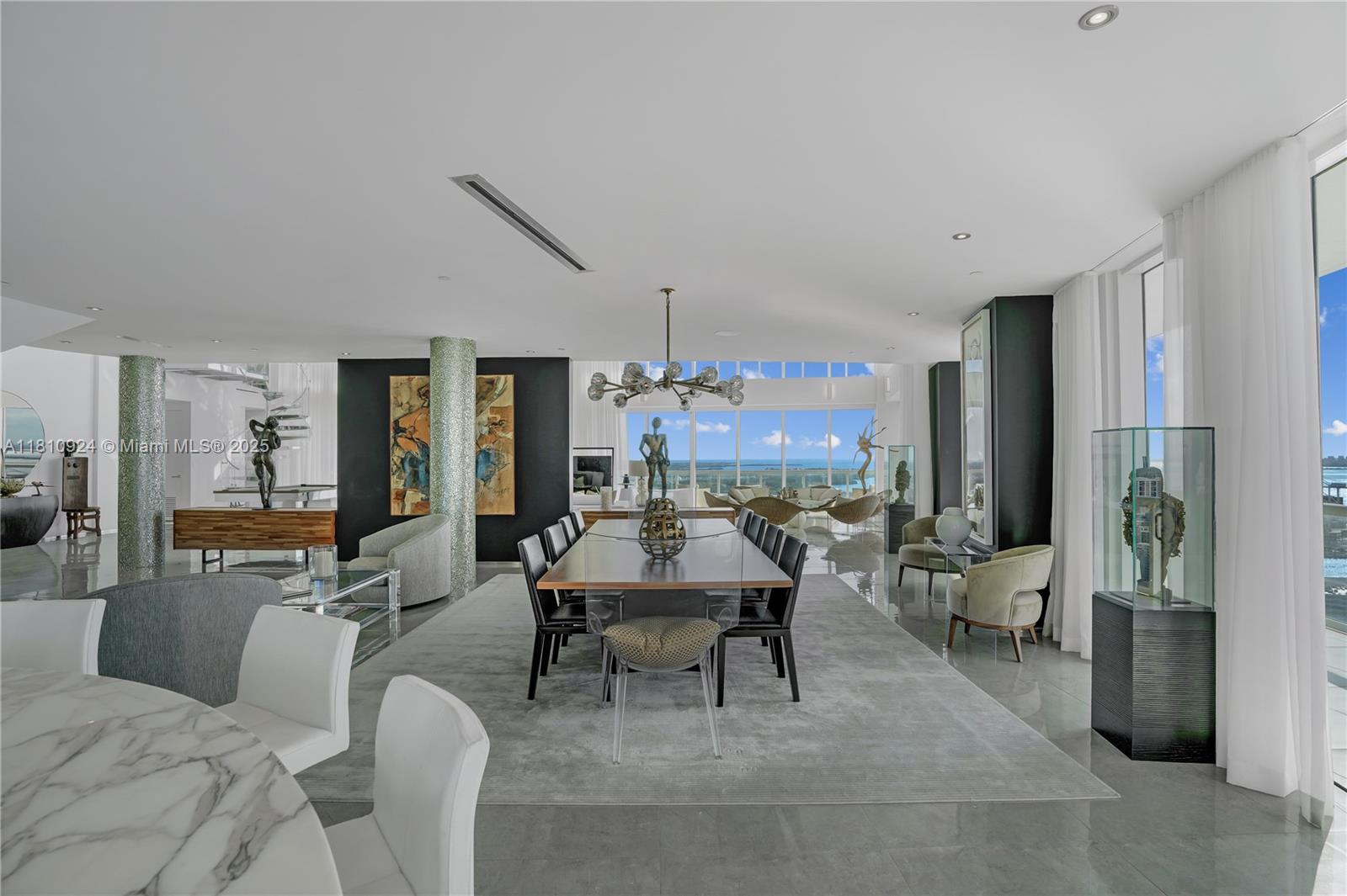 450 Alton Road, Unit PH1 Miami Beach, FL 33139 - Photo 12 of 47 a living room with furniture and a large window