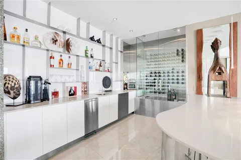 a bedroom with a bed and glass window