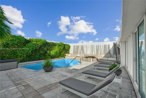 a outdoor living space with furniture and a potted plant