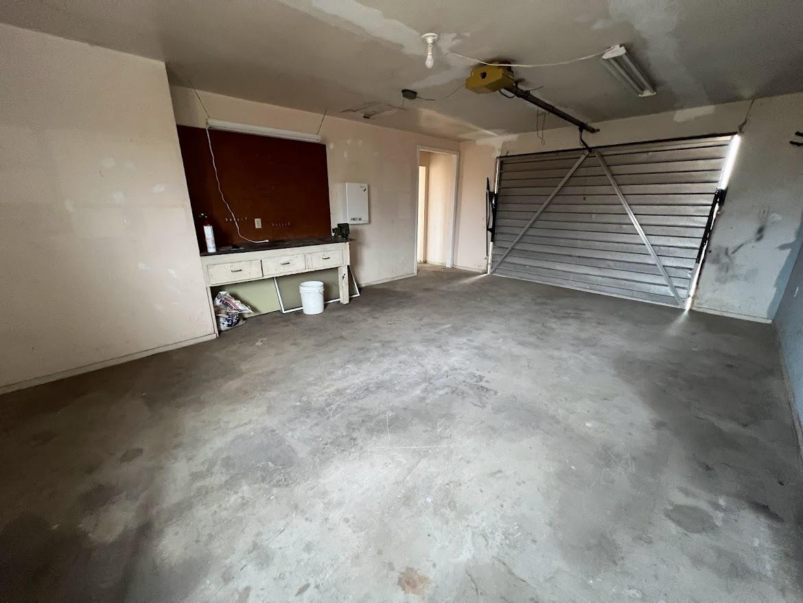 16109 East Manning Reedley, CA 93654 - Photo 28 of 30 a view of an empty room with stairs and a fireplace