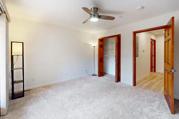 a spacious bathroom with a double vanity sink and a mirror