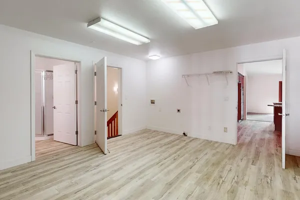 a view of a balcony with wooden floor