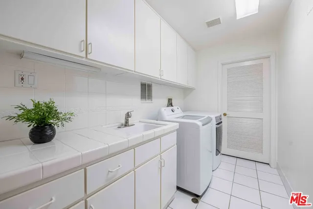 a view of a swimming pool with lounge chairs