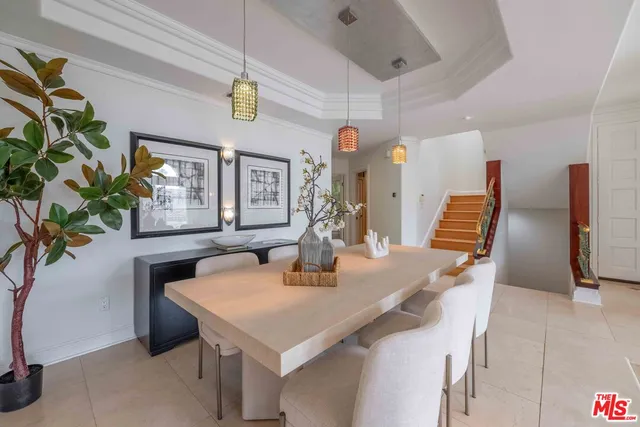 a kitchen with a sink a counter appliances and cabinets