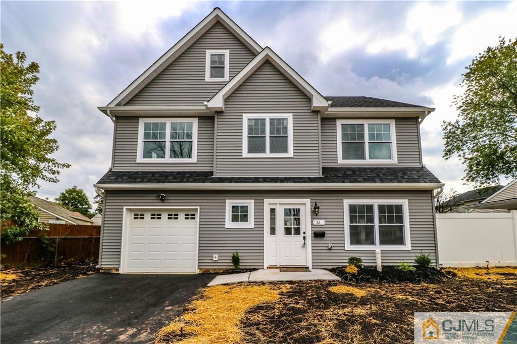 32 Windsor Road Edison, NJ 08817 - Photo 1 of 24 a front view of a house with a yard