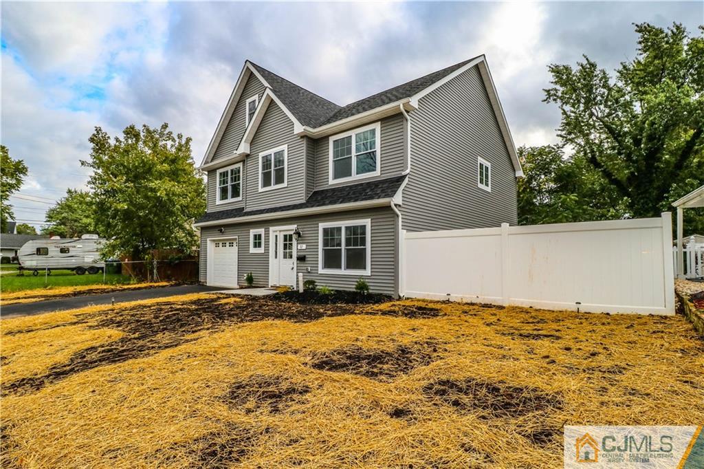 32 Windsor Road Edison, NJ 08817 - Photo 2 of 24 a front view of a house with a yard