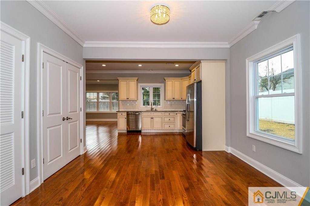 32 Windsor Road Edison, NJ 08817 - Photo 7 of 24 a view of kitchen and hall with wooden floor