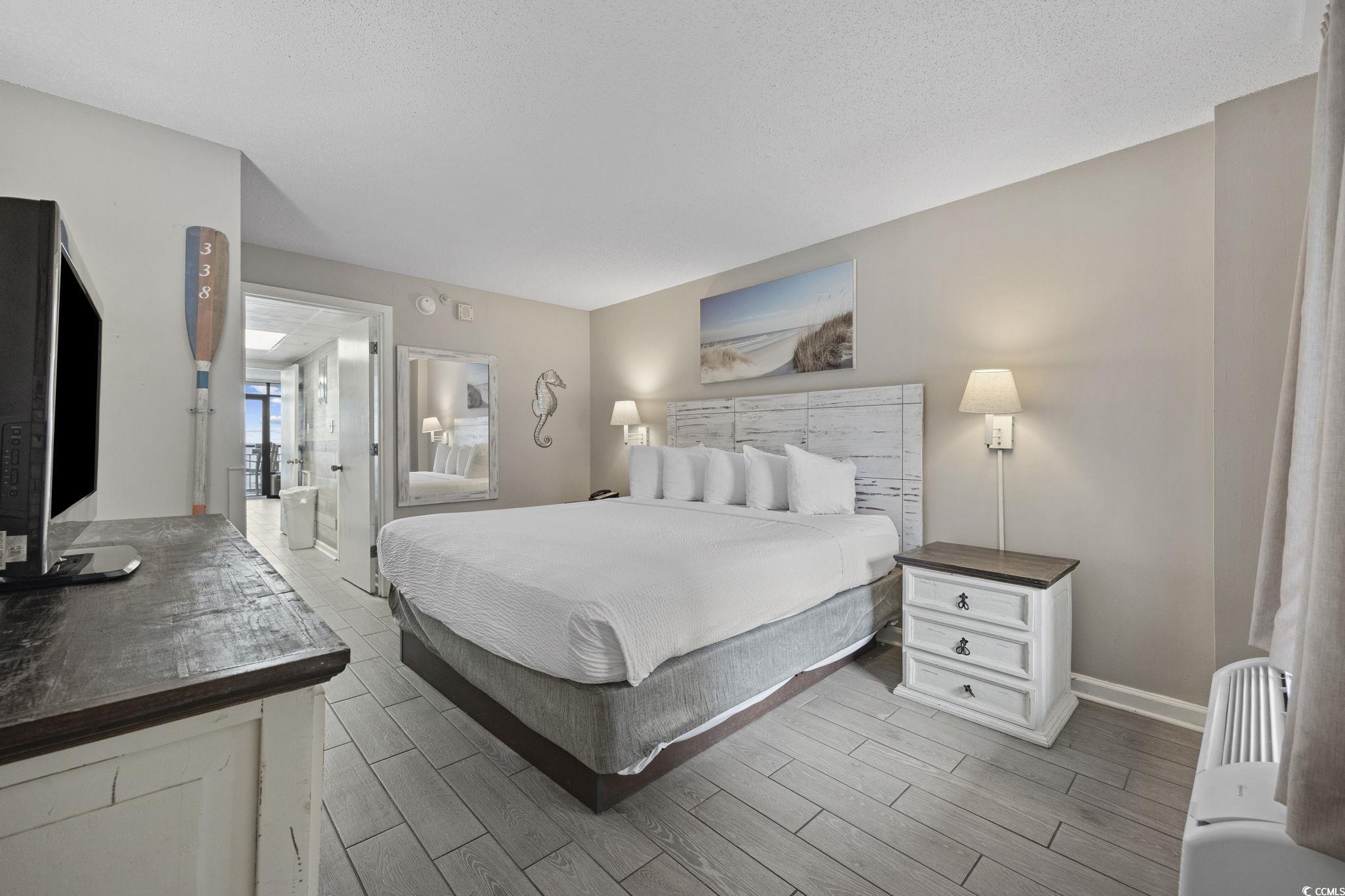 1501 South Ocean Boulevard, Unit 338 Myrtle Beach, SC 29577 - Photo 12 of 40 Bedroom with wood look ceramic tiled floors