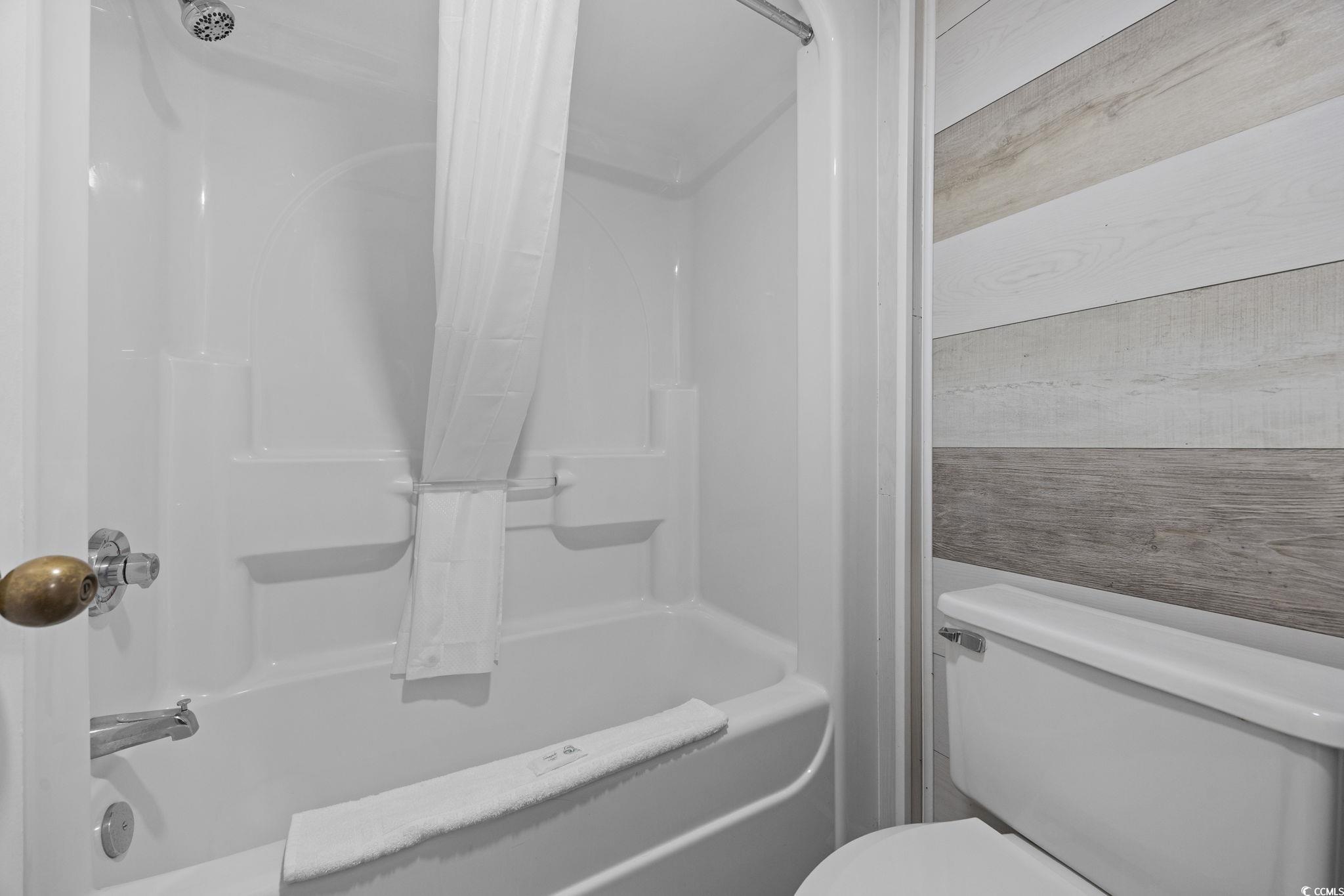 1501 South Ocean Boulevard, Unit 338 Myrtle Beach, SC 29577 - Photo 17 of 40 Full bath with shower / washtub combination and toilet