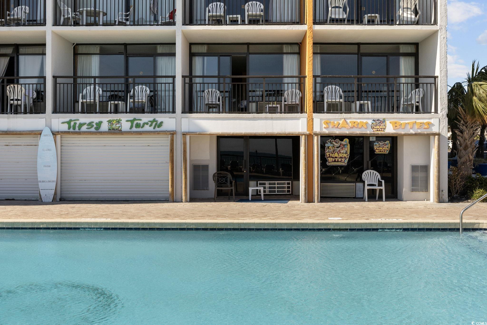 1501 South Ocean Boulevard, Unit 338 Myrtle Beach, SC 29577 - Photo 23 of 40 Community pool with a balcony