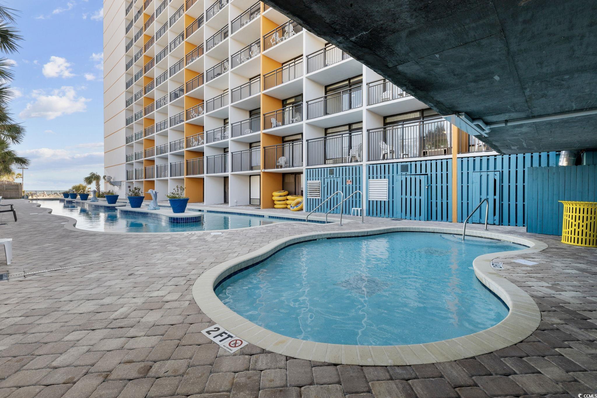 1501 South Ocean Boulevard, Unit 338 Myrtle Beach, SC 29577 - Photo 27 of 40 Community pool featuring a patio area