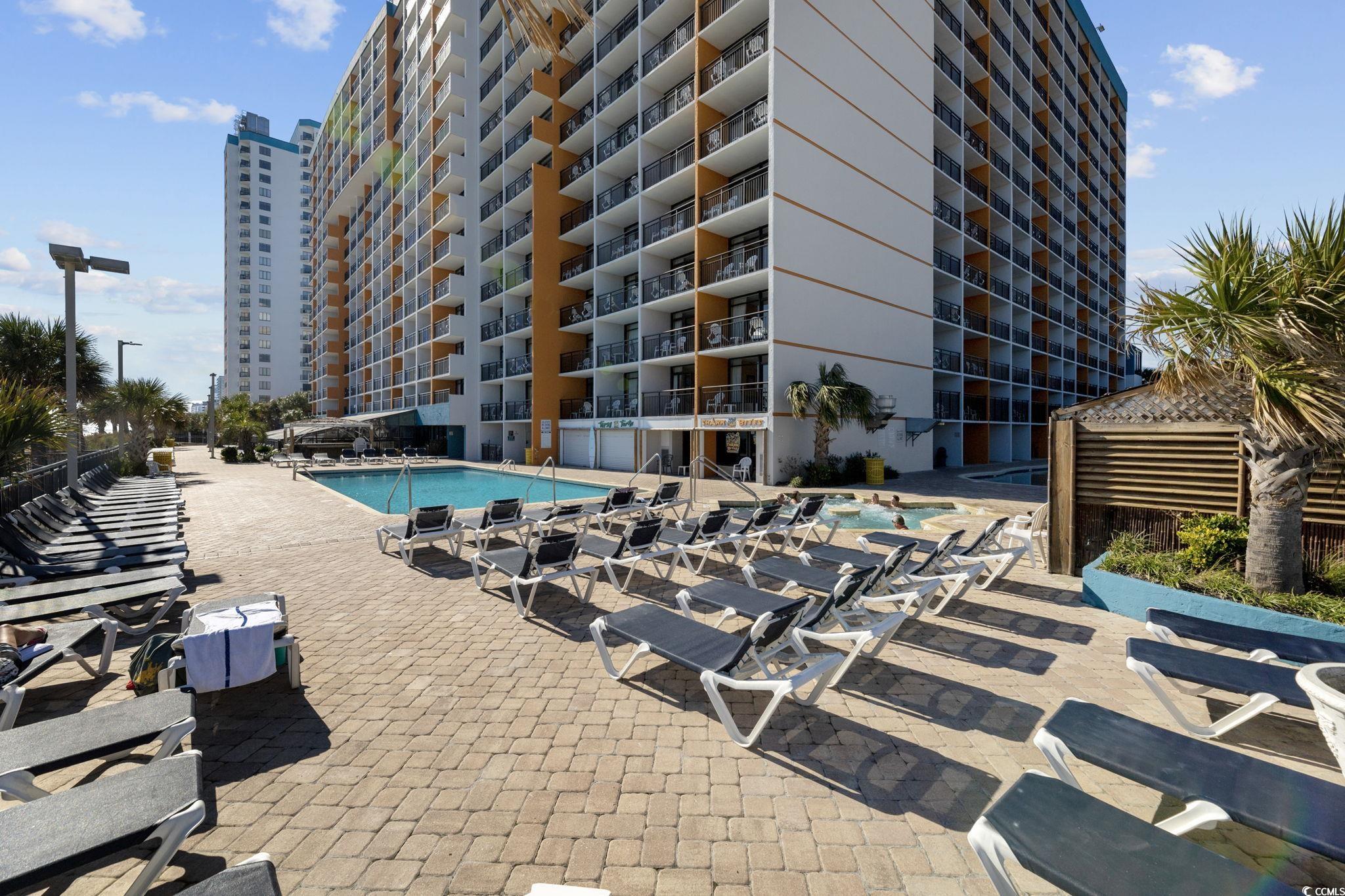 1501 South Ocean Boulevard, Unit 338 Myrtle Beach, SC 29577 - Photo 32 of 40 Community pool with a patio area