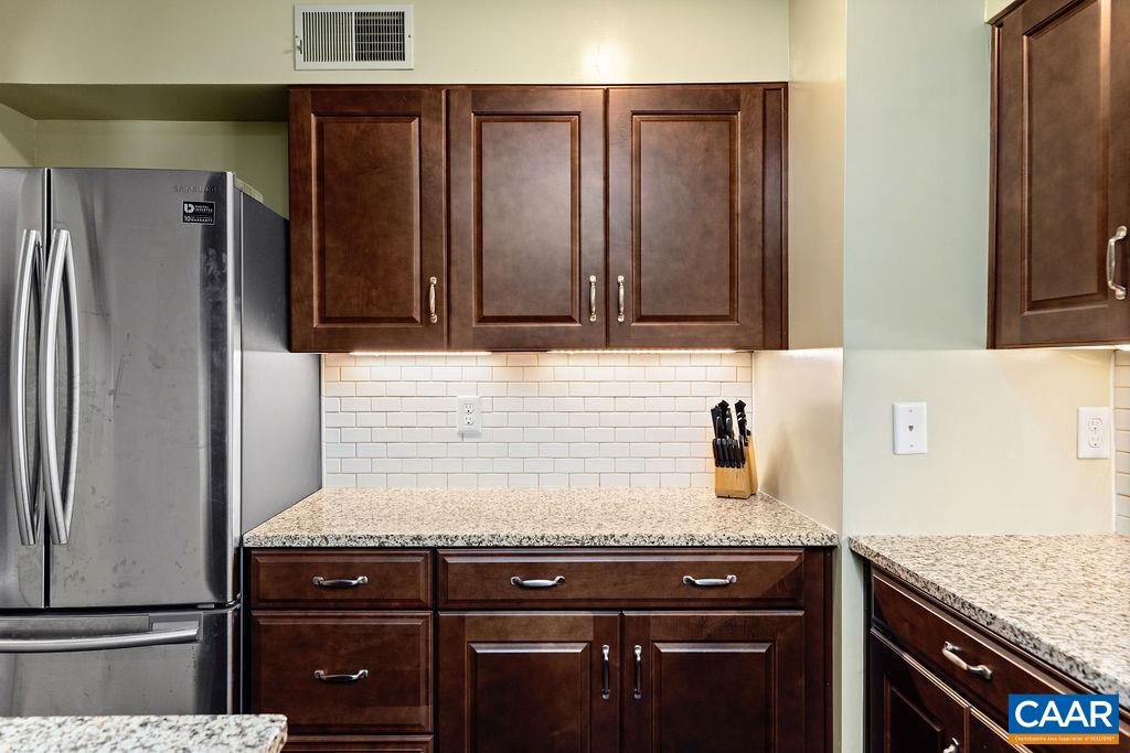 2048 Stone Ridge Wintergreen, VA 22967 - Photo 13 of 36 a kitchen with granite countertop a stove and a refrigerator