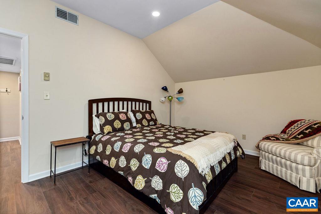 2048 Stone Ridge Wintergreen, VA 22967 - Photo 17 of 36 a bedroom with a bed and wooden floor