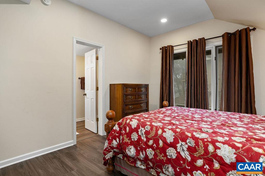 2048 Stone Ridge Wintergreen, VA 22967 - Photo 19 of 36 a bedroom with a large bed and wooden floor