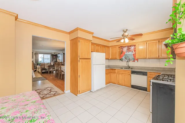 a kitchen with a refrigerator and a sink