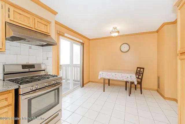 a kitchen with a stove a sink and a microwave