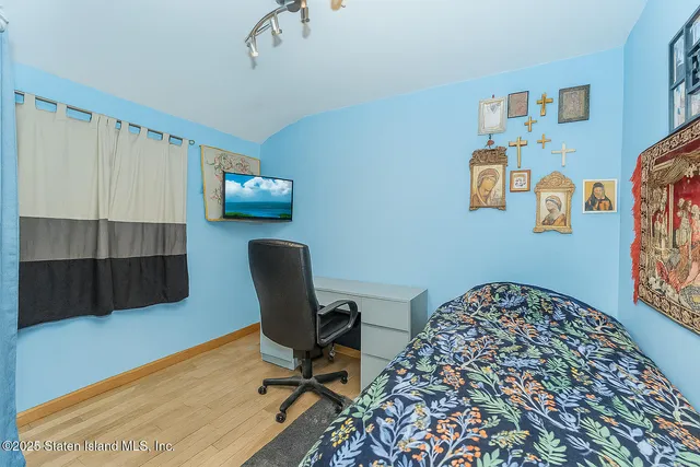 a workspace with furniture and a wooden floor