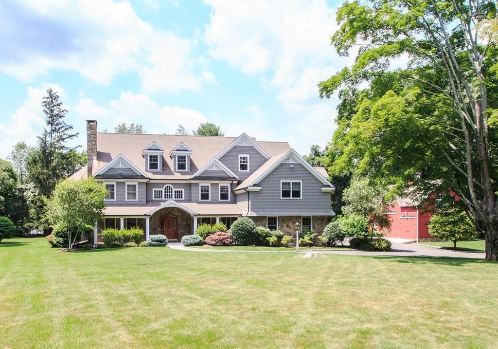296 Cannon Road Wilton, CT 06897 - Photo 1 of 1 a front view of house with yard and swimming pool